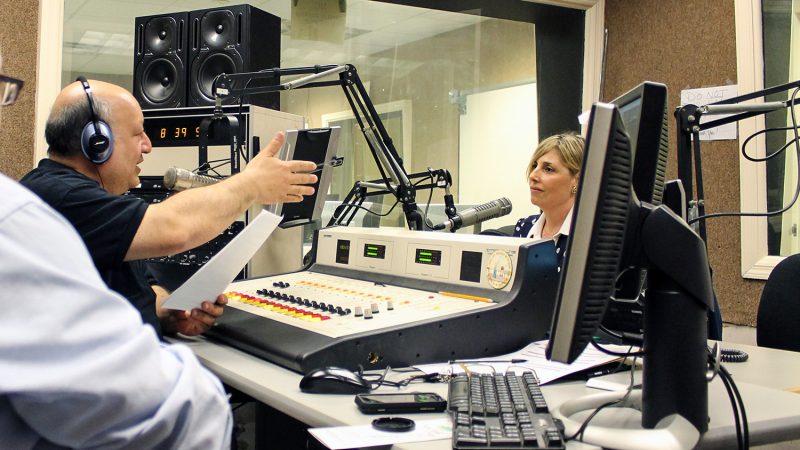 Richard Solomon interviewing guest on radio show
